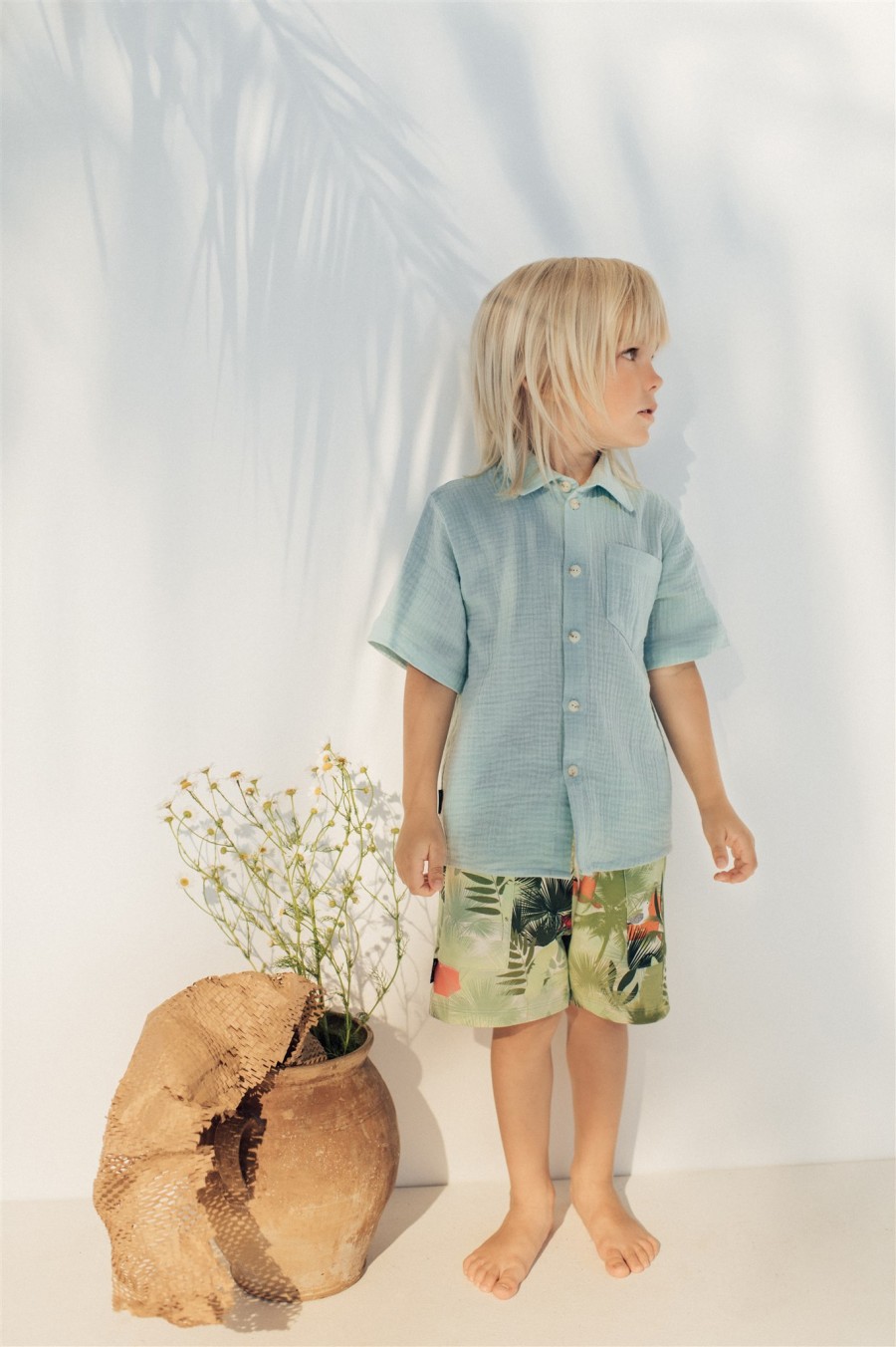 Warm shorts with green palm print for boys SS21049